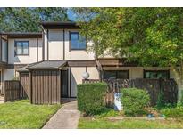 Charming townhouse featuring neutral tones, a fenced front yard, and a walkway leading to the entrance at 4305 Lake Ridge Dr, Raleigh, NC 27604