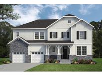 Charming two-story home featuring stone accents, a covered porch, and a well-manicured lawn at 56 Alex Farm Ct # 24, Zebulon, NC 27597