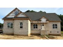 Charming brick home featuring a classic design with a covered entry at 7337 Twin Pines Rd, Spring Hope, NC 27882