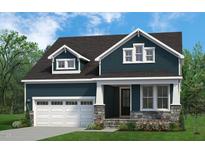 Charming two-story home with a dark blue exterior, stone accents, white trim, and well-manicured lawn at 816 Ballaster Rd, Fuquay Varina, NC 27526