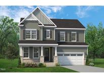 Charming two-story home with a two-car garage, elegant siding, and a welcoming front porch at 824 Ballaster Rd, Fuquay Varina, NC 27526