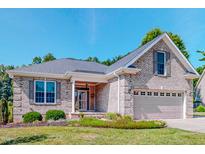 Charming single-Gathering home featuring a brick facade, well-manicured lawn, and attached two-car garage at 90 S Old Lantern Rd, Timberlake, NC 27583