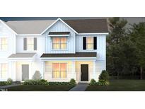 Charming two-story home featuring stylish architecture and manicured landscaping at 290 Fosterton Cottage Way, Raleigh, NC 27603