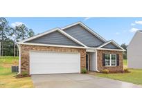 Charming single-story home featuring a brick facade, gray siding, and an attached two-car garage at 528 Lochalsh Dr, Gibsonville, NC 27249