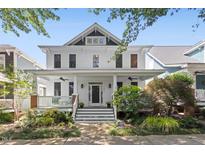 Charming two-story home featuring a welcoming front porch and beautifully landscaped front yard at 10570 Evergreen Spring Pl, Raleigh, NC 27614
