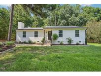Charming home with a well-maintained front yard and inviting entrance at 1104 Suterland Rd, Cary, NC 27511