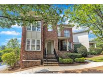 Beautiful brick townhouse featuring a charming entrance and landscaped front yard at 117 Finsbury St, Durham, NC 27703