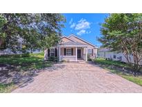 Charming single-story home with a cozy front porch and a well-maintained front yard at 4928 Silverdene St, Raleigh, NC 27616