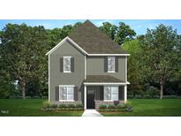 Charming two-story home featuring a mix of siding textures and welcoming front porch at 561 Lemon Daisy Ln, Knightdale, NC 27545