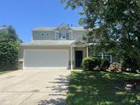 Charming two-story home with a two-car garage, and well-maintained landscaping at 5819 Finestra Way, Raleigh, NC 27610
