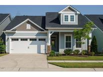 Charming single-Gathering home featuring a two-car garage, craftsman details, and well-maintained landscaping at 660 Still Willow Ln, Wendell, NC 27591