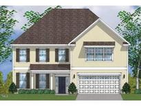 Charming two-story home with a welcoming facade and a well-manicured lawn at 235 N Maple Walk Dr # 220, Garner, NC 27529