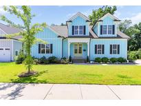 Charming two-story home with a well-manicured lawn and bright, inviting curb appeal at 2635 High Plains Dr, Fuquay Varina, NC 27526