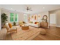 Bright living room with wood floors, modern furniture, and decor at 501 Finsbury St # 204, Durham, NC 27703