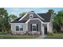 Charming home featuring gray siding, stone accents, manicured lawn and landscaping, and a welcoming front entry at 541 Lemon Daisy Ln, Knightdale, NC 27545