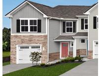 Charming two-story home with a gray exterior, stone accents, and a two-car garage for convenient parking at 6657 Gibraltar Rock Dr, Raleigh, NC 27610