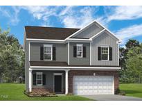 Charming two-story home featuring gray siding, black shutters, and an attached two-car garage at 88 Freedom Heights Ln # 148, Smithfield, NC 27577