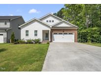 Charming single-Gathering home with a well-manicured lawn and a brick and siding facade at 112 Lager Ln, Garner, NC 27529