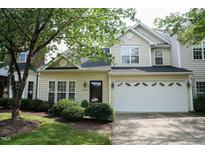 Charming two-story home featuring a two-car garage and beautifully landscaped front yard at 3423 Van Hessen Dr, Raleigh, NC 27614