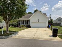 Charming single-Gathering home with a two-car garage, well-manicured lawn, and a traditional design at 44 Glen Meadow Dr, Angier, NC 27501
