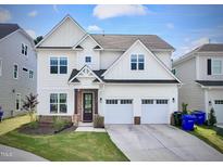 Charming two-story home with a well-manicured lawn and a two-car garage at 533 Kings Lake Way, Durham, NC 27703