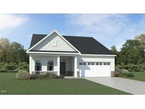 Charming single-story home featuring stone accents, a two-car garage, and a well-manicured lawn at 1102 Red Roses Ave, Durham, NC 27703
