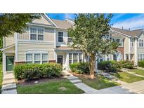 Charming townhome with manicured landscaping and welcoming front entrance in a lovely neighborhood at 127 Cedar Elm Rd, Durham, NC 27713