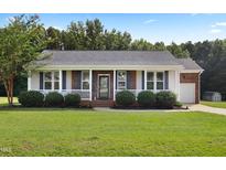 Charming one-story home with a well-maintained lawn and inviting front porch at 139 His Way, Middlesex, NC 27557