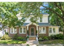 Charming two-story brick home with landscaped front yard and inviting entryway at 304 Polk St, Raleigh, NC 27604