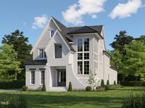 Beautiful two-story home featuring brick accents, a manicured lawn, and expertly crafted windows at 1531 Salem Church Rd, Apex, NC 27523
