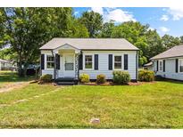 Charming single-story home with black shutters and landscaped front yard at 1543 Wickham St, Burlington, NC 27215