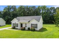 Charming single-story home with a well-manicured lawn and inviting front entrance at 236 Katie Dr, Rocky Mount, NC 27803