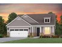 Charming single-story home featuring a two-car garage, dormer window and welcoming front porch at 273 Arcadius Dr, Clayton, NC 27520