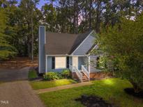 Charming two-story home with a landscaped front yard and gravel driveway at 5721 Meadow, Knightdale, NC 27545