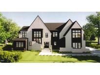 Charming two-story home with a striking modern design, multiple windows, and fresh landscaping at 6908 Bent Pine Pl, Raleigh, NC 27615