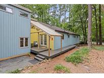 Charming home exterior featuring a porch and natural surroundings at 908 Cedar Fork Trl, Chapel Hill, NC 27514