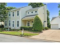 Charming two-story home featuring a well-manicured front yard, attached garage, and classic architectural details at 2000 Silky Dogwood Trail Trl, Apex, NC 27502