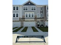 Charming townhome with attached garages, stone accents, and modern design in a friendly community at 5324 River Reach Dr, Raleigh, NC 27616