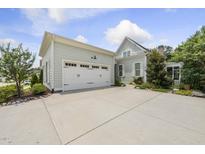 Charming home featuring a two-car garage, well-maintained landscaping, and a concrete driveway at 733 Daniel Ridge Rd, Wendell, NC 27591