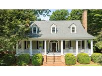 Charming home with large front porch and landscaped yard at 12201 Lockhart Ln, Raleigh, NC 27614