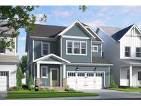 Charming two-story home with blue siding, white trim, an attached garage, and lovely landscaping at 154 Beacon Dr, Pittsboro, NC 27312