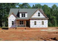 Two-story home with a charming covered porch and a mix of brick and siding exterior at 25 Autumnwood Ln, Spring Hope, NC 27882