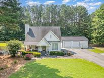 Charming home with well-manicured lawn and a detached two-car garage at 255 Morris Rd, Pittsboro, NC 27312