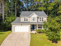 Charming two-story home with a well-manicured lawn and attached two car garage at 4600 Landover Dale Dr, Raleigh, NC 27616