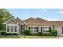 Charming single-story home featuring a well-manicured lawn, a sunroom, and a two-car garage at 4622 Ivy Blossom Ln, Raleigh, NC 27604