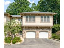Charming townhouse with stone accents and attached two-car garage at 4831 Crestmore Rd # 202, Raleigh, NC 27612