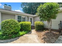 Charming single-story home with a well-manicured lawn and a welcoming front entrance at 6016 Farm Gate Rd, Raleigh, NC 27606