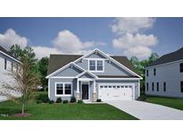 Charming one-story home features a light blue exterior, manicured lawn, and attached two-car garage at 124 Sugarmaple Way, Youngsville, NC 27596
