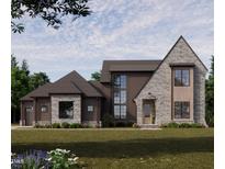 Modern two-story home featuring a stone and wood facade, large windows, and a well-manicured lawn at 1725 Legacy Ridge Ln, Wake Forest, NC 27587