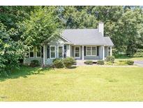 Charming one-story home with a well-maintained lawn and mature trees at 2474 Sumter Dr, Garner, NC 27529